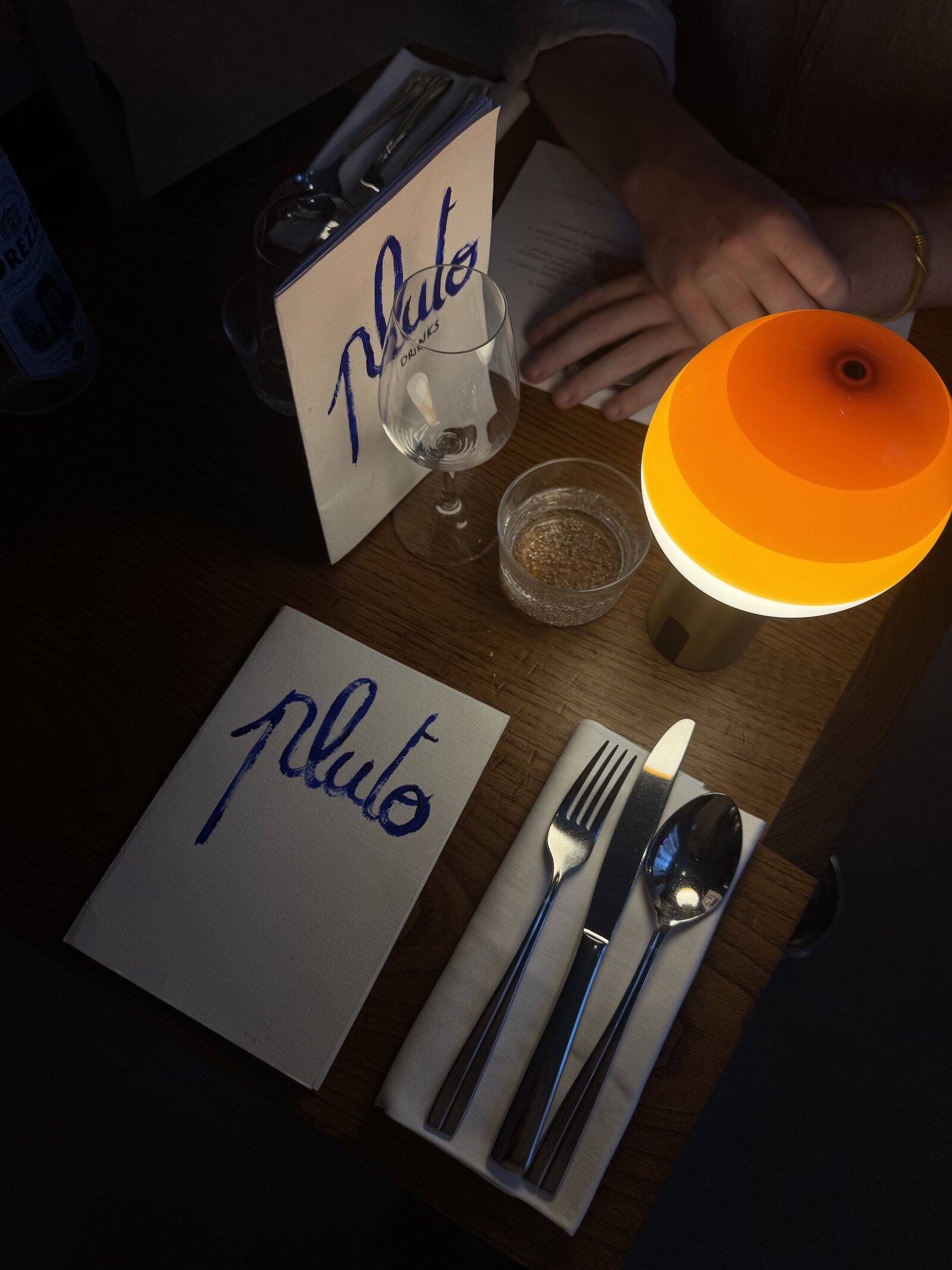 a table setting at pluto, paris