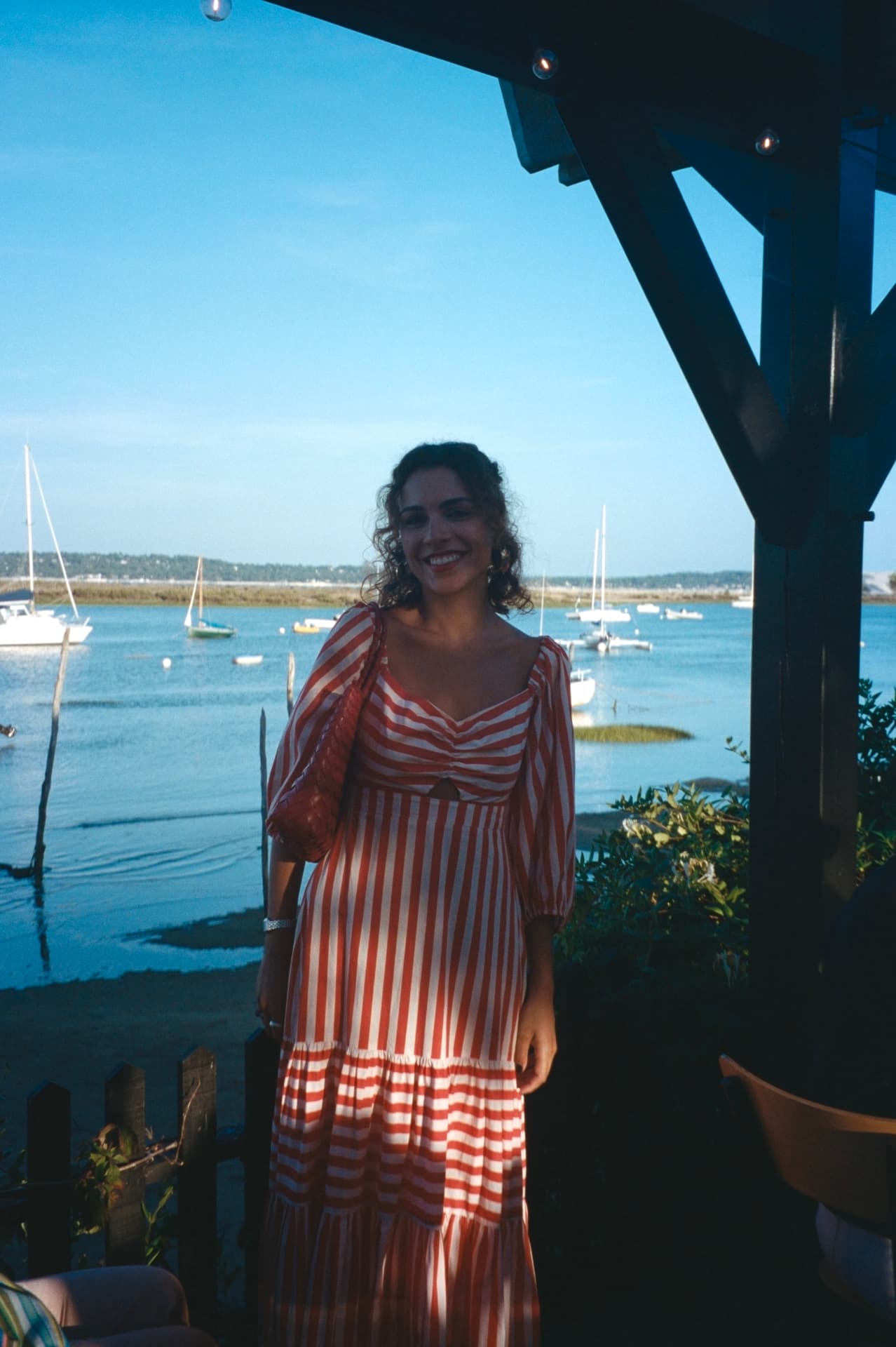 nati in a striped dress by the bassin at golden hour