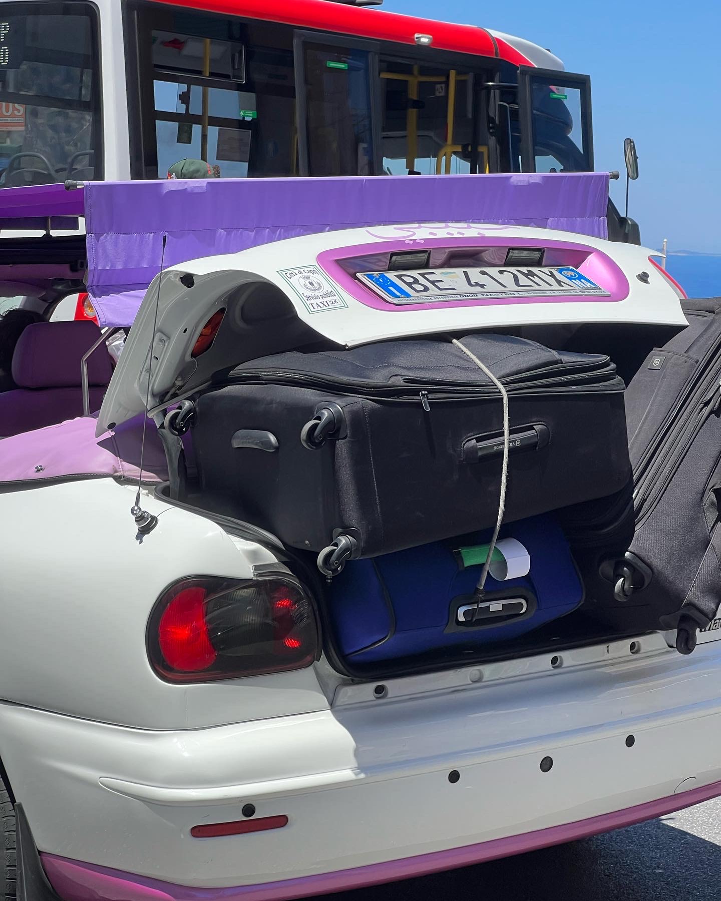 luggage strapped to a taxi in capri