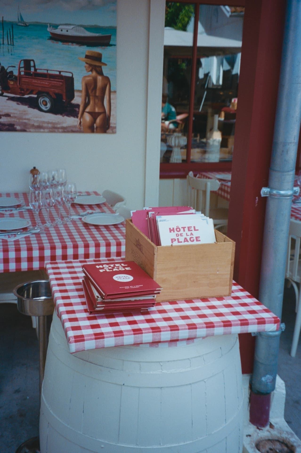 menus and a gingham table at hôtel de la plage, l'herbe